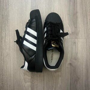 black and white adidas superstars sneakers